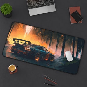 May include: A blue sports car drives through a foggy forest with orange flames coming from the exhaust. The car has a black spoiler and black wheels. The forest is dark and mysterious.