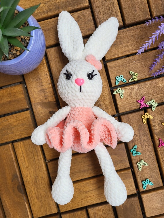 A Rabbit In A Pink Dress Is Dancing With A Ballerina | Premium AI