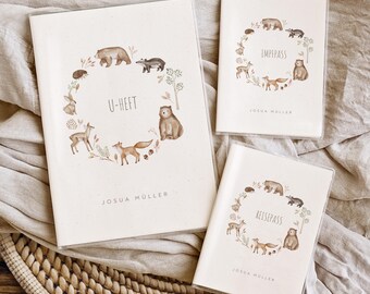 May include: Three white covers with a woodland animal theme. The covers have a wreath of animals including a bear, fox, deer, and hedgehog. The text on the covers reads "U-Heft", "Impass", and "Reisepass".