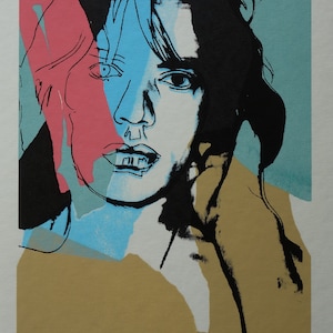 May include: Pop art style portrait print featuring a person's face with bold colors. The artwork uses pink, blue, black, and tan hues. Signed by Amy Webb, numbered 15/300.