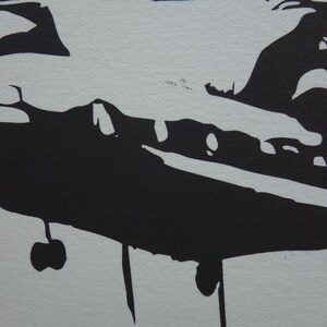 May include: Black silhouette of a helicopter with landing gear and a propeller on a white background.