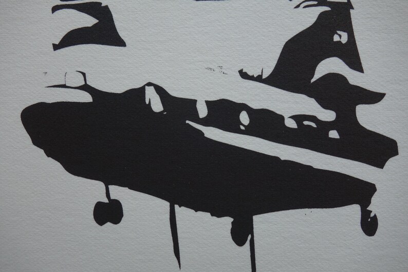 May include: Black silhouette of a helicopter with landing gear and a propeller on a white background.