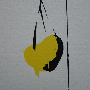 May include: Abstract art print featuring a yellow and black shape with a thin black line extending from the top.