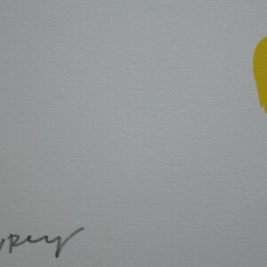 May include: Black and yellow abstract art print with the artist's signature "Bavrey" in the bottom left corner.