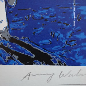 May include: A blue and white abstract print with a silver signature by Amy Winehouse.
