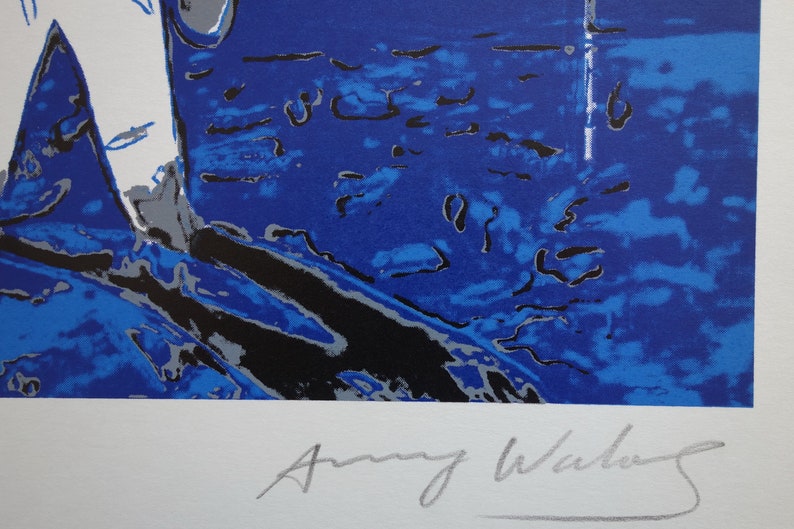 May include: A blue and white abstract print with a silver signature by Amy Winehouse.
