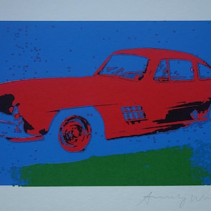 May include: A red vintage car with a blue background. The car is a classic coupe with a black interior and chrome accents. The car is in a stylized, almost cartoonish style.