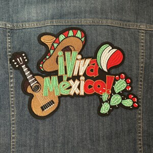 May include: A colorful embroidered patch with a sombrero, guitar, cactus, and the text "Viva Mexico!"