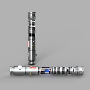 May include: A silver lightsaber with a blue blade and a silver hilt. The lightsaber is in two pieces, with the hilt separated from the blade. The hilt has a red button and a silver knob.
