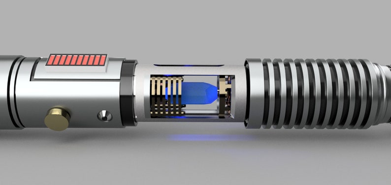 May include: A silver lightsaber with a blue blade and a red power indicator. The lightsaber is cut open to reveal the internal components.