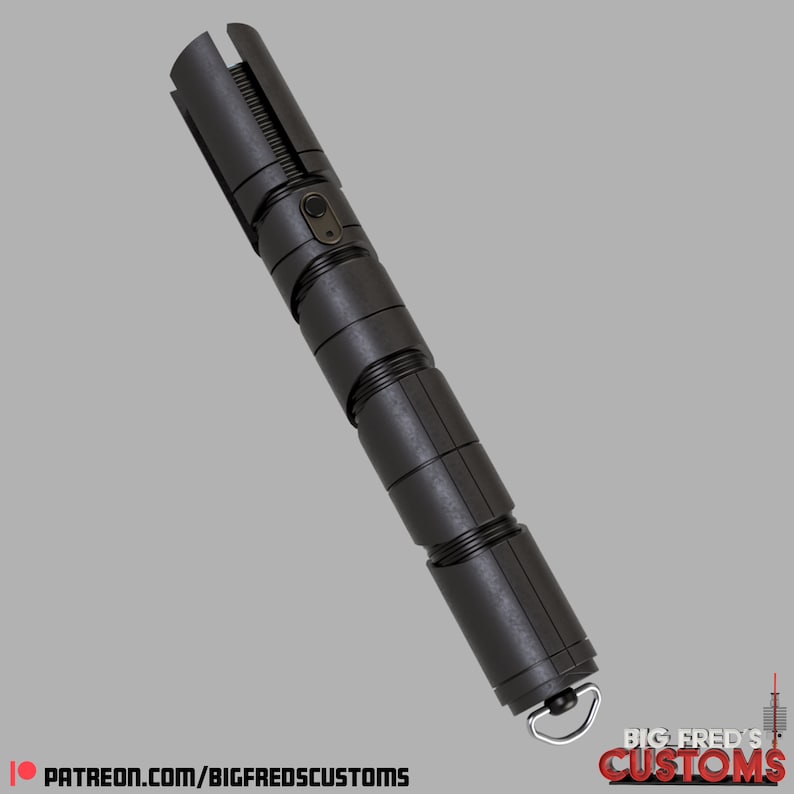 May include: A black lightsaber with a textured metal finish and a silver button. The lightsaber is extended and has a ring at the end. The text "BIG FRED'S CUSTOMS" is visible on the bottom right of the image.