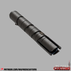 May include: A black lightsaber with a silver button and a textured, segmented design. The lightsaber is made of metal and has a blue light at the end.