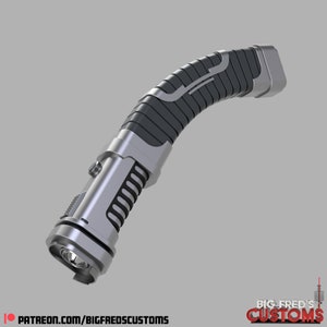 May include: A silver and black lightsaber hilt with a textured grip and a curved handle. The hilt has a silver button on the side and a black ring around the end.