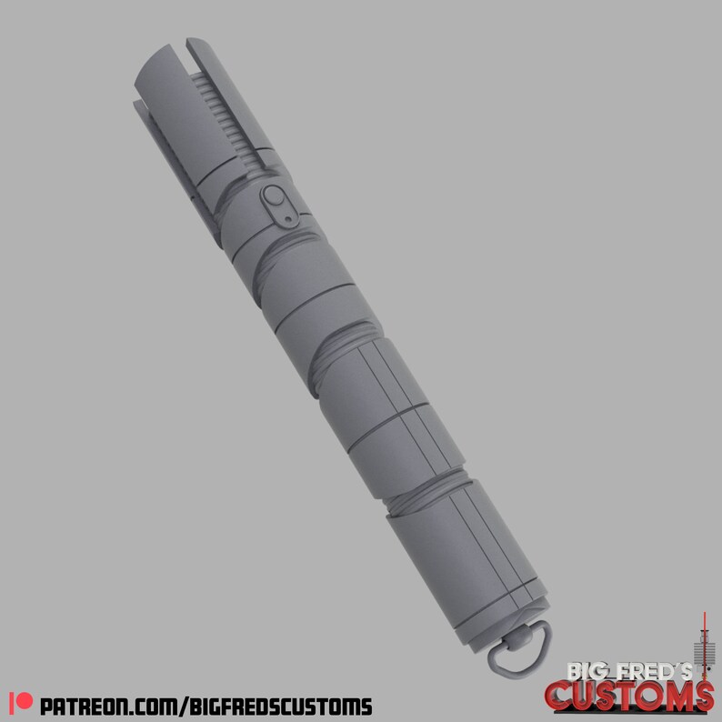 May include: A gray lightsaber with a textured surface and a black button. The lightsaber has a ring at the end with the text "BIG FRED'S CUSTOMS" on it.