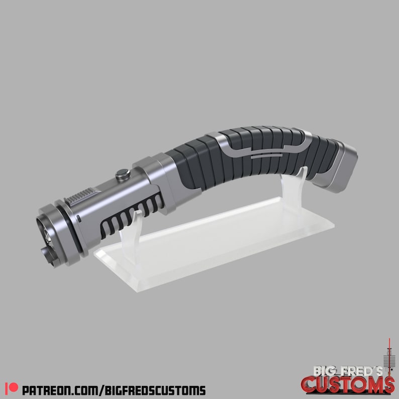 May include: A silver and black lightsaber with a curved handle and a clear plastic display stand. The lightsaber has a textured grip and a silver button on the side.