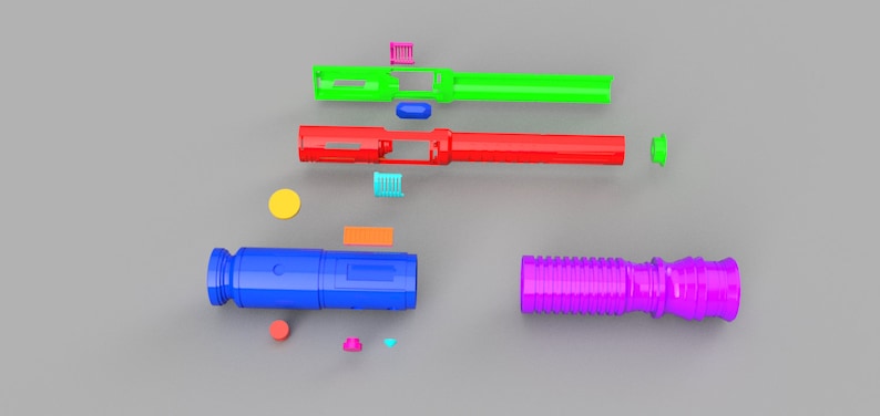 May include: Assortment of colorful plastic pieces for building a toy lightsaber. The pieces include a green, red, blue, and purple tube, a yellow circle, and several small rectangular pieces in various colors.
