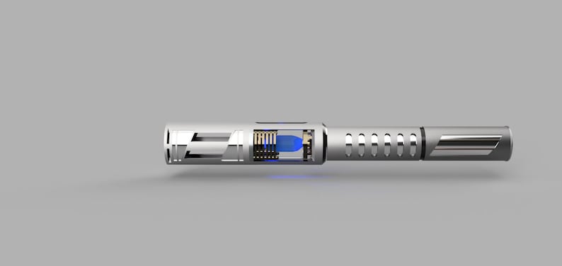 May include: A silver-colored, cylindrical object with a blue light inside. The object has a series of holes and a black stripe on the side.