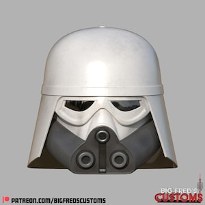 Puede incluir: Un casco blanco y gris con una parte superior redondeada, visera y una sección inferior de la cara gris oscuro. El casco tiene un diseño distintivo con una boca y área de los ojos prominentes. El texto "BIG FRED'S CUSTOMS" y una dirección web son visibles.