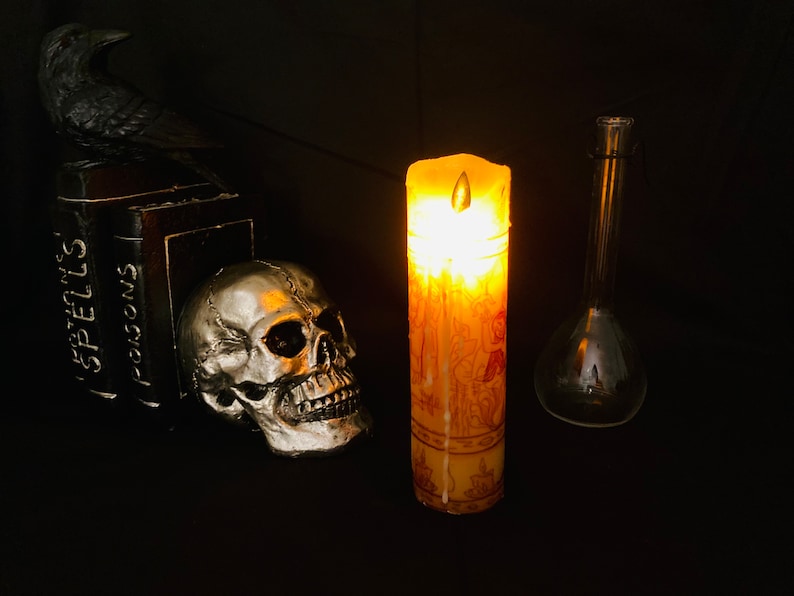 Real wax battery operated LED Hocus Pocus black flame candle.  Long lasting without the safety risks of a real flame.