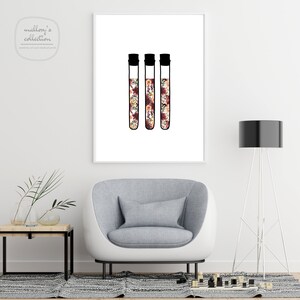 May include: Three black test tubes filled with a floral pattern in shades of pink, orange, and white. The test tubes are on a white background.