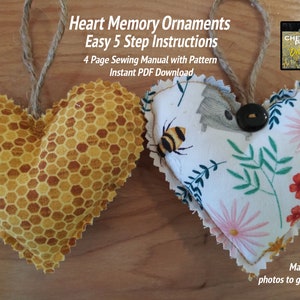 May include: Two heart-shaped ornaments with twine hangers. One is yellow with a honeycomb pattern, the other has a floral and bee design. Text reads "Heart Memory Ornaments" and "Easy 5 Step Instructions".