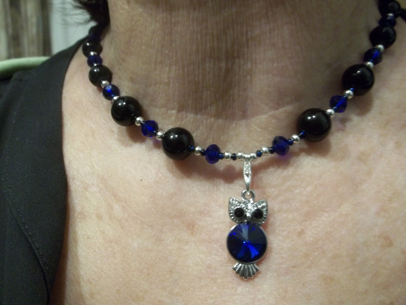 black dark blue and silver 18 inch necklace with owl pendant attached