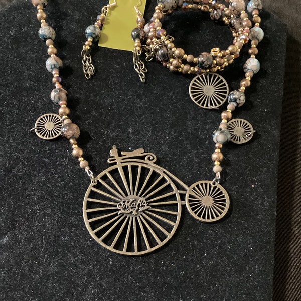 unique, steampunk vibe, vintage, victorian, recycled, necklace set, pendant necklace with velocipede penny farthing bike, coil bracelet