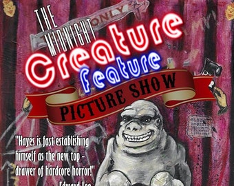May include: A vintage-style poster for "The Midnight Creature Feature Picture Show." It features a gray, smiling creature on a stool, with text including "David C. Hayes" and a quote about hardcore horror. The background is a mix of pink and brown.