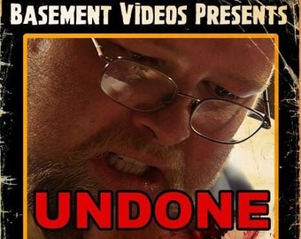 May include: A VHS tape cover with a red and white title "UNDONE" and a warning that the short film is intended for mature audiences only. The cover features a man with a beard and glasses, and a bloody image of a person's head.