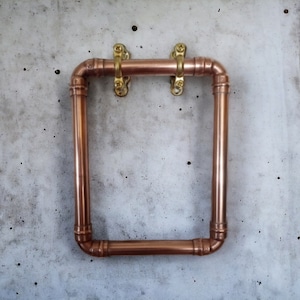Handmade copper towel ring with brass fixings made from 15mm copper pipe