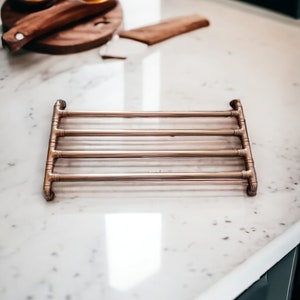 Large Copper pan trivet with protective feet,
