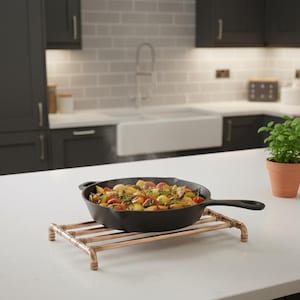 Large copper pan trivet with protective feet,