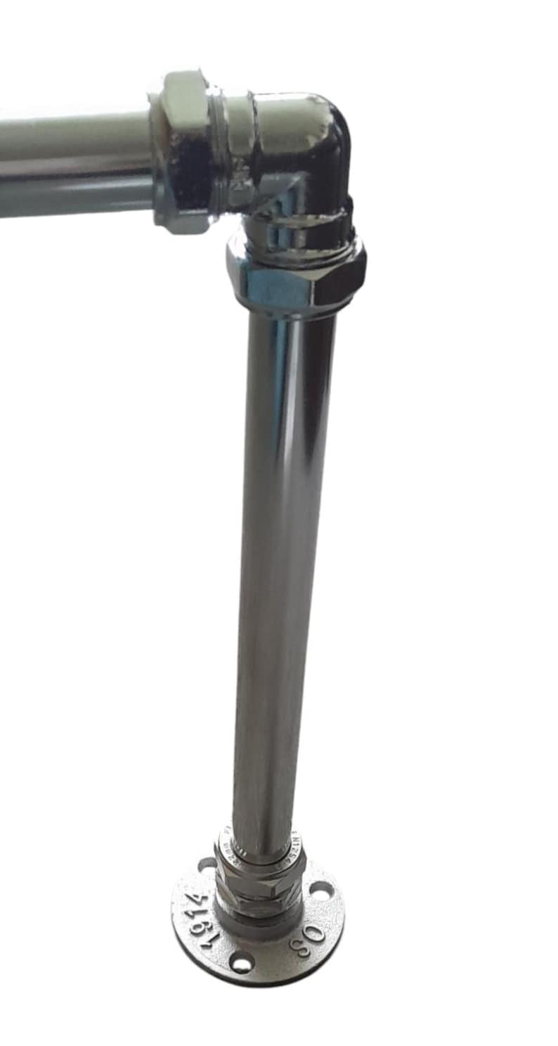 May include: Chrome-plated metal pipe fitting with a 90-degree elbow and a flange. The flange has the numbers "088" and "4161" stamped on it.