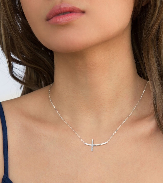 Sideways curved cross necklace discount