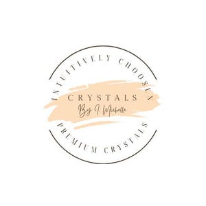 May include: A circular logo featuring a dark brown outline with the text INTUITIVELY CHOSEN and PREMIUM CRYSTALS. In the center, a light peach-colored brushstroke background displays the text CRYSTALS By J. Michelle in dark brown lettering.