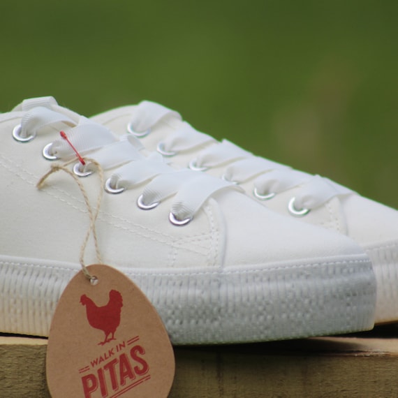 white canvas trainers