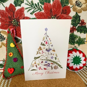 Tarjeta de Navidad flor prensada