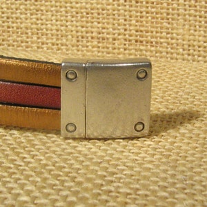 Nitdetalj 15 mm platta läderspännen - Antiksilver - MAG10