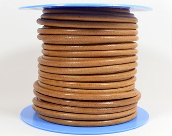May include: A spool of brown leather cord, wound tightly and ready for crafting projects.