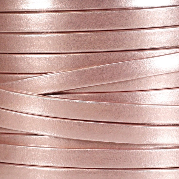 May include: A close-up of a roll of rose gold leather cord. The cord is smooth and shiny, and it is ideal for crafting jewellery or other projects.