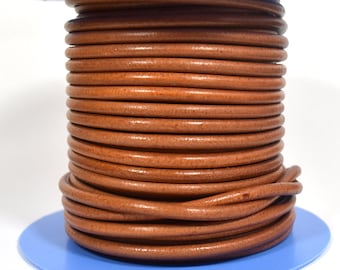 May include: A spool of brown leather cord, wound tightly and ready for crafting projects.