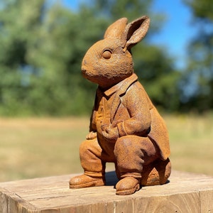 Garden sculpture of a rabbit with a pipe | English garden