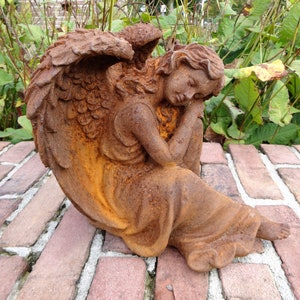 Old garden sculpture of an Angel - romantic garden decor