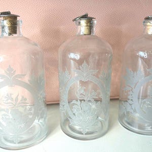 Etched Glass Apothecary Bottles with silver crock stopper top, Vintage Glass Bottles, Floral Etched Glass