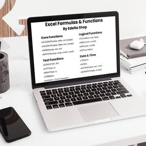 May include: A silver laptop displaying a white screen with black text titled Excel Formulas & Functions By Edelta Shop, listing categories for Core, Logical, Text, and Date & Time functions with specific formula examples like VLOOKUP and IF.