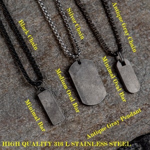 May include: Four different chain styles with pendants. The chains are black, silver, and antique gray. The pendants are a small rectangular bar, a medium oval bar, a large oval bar, and a small oval pendant.