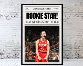 May include: A newspaper headline announcing "ROOKIE STAR!" with the subheading "CLARK WINS ROOKIE OF THE YEAR". A woman wearing a red basketball jersey with the number 22 and the word "FEVER" on it is pictured in the background.
