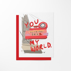 May include: Red and white illustrated card with the text "You are my world."  The illustration features a red sign with the words "Almond Rock" and a clock.