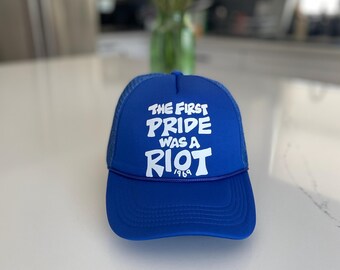The first pride was a riot trucker hat : Blue