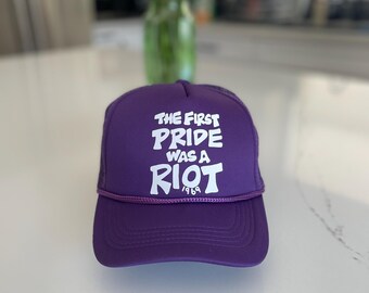 The first pride was a riot trucker hat : Purple
